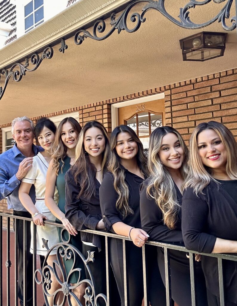 Dr. Taylor and his staff lined up in front of the office